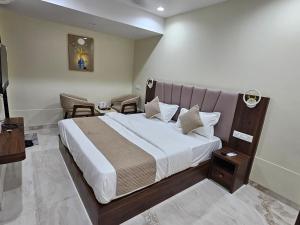 Krevet ili kreveti u jedinici u okviru objekta The Eiffel Hotel & Banquet