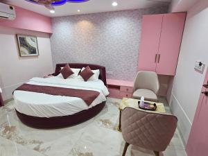Krevet ili kreveti u jedinici u okviru objekta The Eiffel Hotel & Banquet