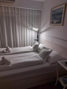 Posteľ alebo postele v izbe v ubytovaní Studio S + 6 fotografií
