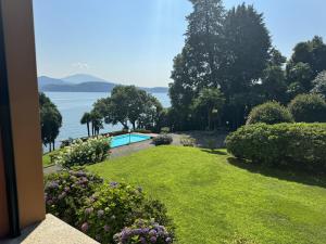 a garden with a view of the water at Marta in Stresa