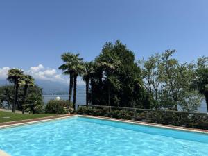 a swimming pool with a view of the water at Marta in Stresa