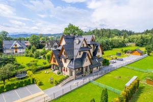 an aerial view of a home with a large house at DW Boguń Pokoje i Apartamenty in Białka Tatrzańska +65 photos