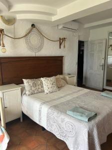 a bedroom with a large bed and a mirror at Las Tres Patas Complejo Rural in Enix +68 photos