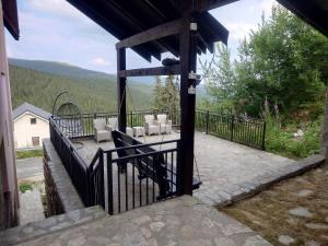 a balcony with a table and chairs on it at Casa Veves in Ranca