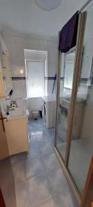 a small kitchen with a sink and a window at APARTAMENTO SUJARRERA in Villacarriedo +11 photos