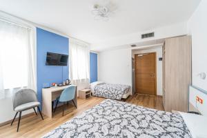Posteľ alebo postele v izbe v ubytovaní Hotel Italia
