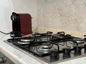 a stove top oven sitting on top of a kitchen counter at A 2 passi dal blu in Roseto degli Abruzzi