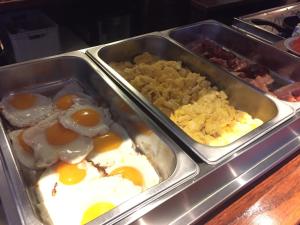 
a tray filled with different types of food at New City Hotel Scheveningen in Scheveningen
