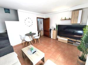 Μια τηλεόραση ή/και κέντρο ψυχαγωγίας στο Casa Daria - WiFi - swimming pool - FuerteventuraBay