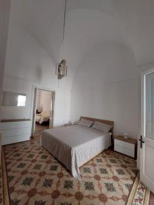 A bed or beds in a room at Casa Paola