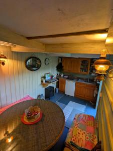an overhead view of a kitchen with a table at Highview Hideaway in Upchurch +7 photos
