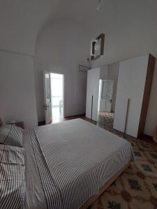 A bed or beds in a room at Casa Paola