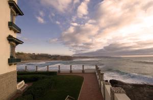 a view of the ocean from the balcony of a house at Vila Gale Ericeira in Ericeira
