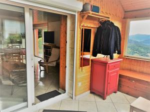 a room with a door open to a kitchen with a window at Maison indépendante avec jardin, terrasse et cheminée à Saulxures-sur-Moselotte - FR-1-589-339 in Saulxures-sur-Moselotte