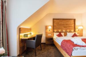 Postel nebo postele na pokoji v ubytování Hotel Restaurant Waldsägmühle