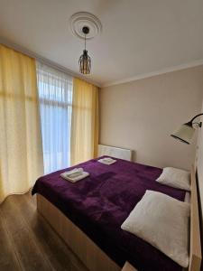 Ένα ή περισσότερα κρεβάτια σε δωμάτιο στο DISCOVER KAZBEGi HOTEL