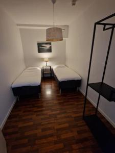 Postel nebo postele na pokoji v ubytování Nr8 På Spåret