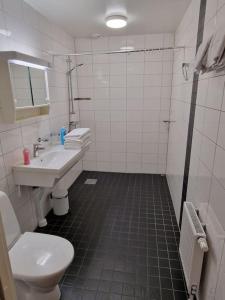 Koupelna v ubytování Nr8 På Spåret + 7 fotografií