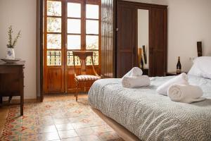 Postel nebo postele na pokoji v ubytování HOTEL BODEGA VERA DE ESTENAS