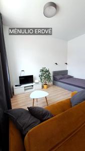 a living room with a couch and a table at Mano erdvės in Anykščiai +11 photos