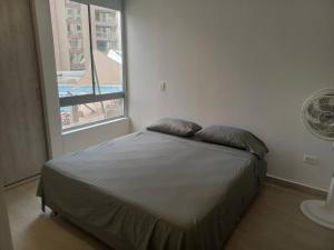Ένα ή περισσότερα κρεβάτια σε δωμάτιο στο Apartamento Ámbar Villeta