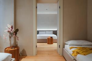 Postel nebo postele na pokoji v ubytování C10 Boutique Hotel