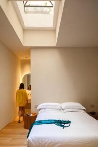 Postel nebo postele na pokoji v ubytování C10 Boutique Hotel
