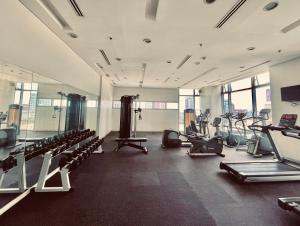 a gym with a lot of treadmills and machines at Corner Studio in Ermita Manila near US Embassy and SLMEC in Manila