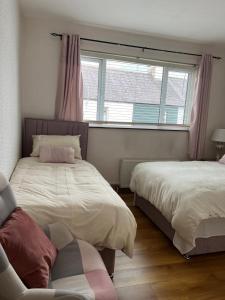 Voodi või voodid majutusasutuse Triple Room with Private Bathroom toas