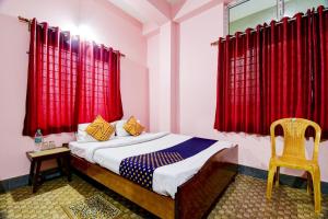 Hotel O NANDINI客房内的一张或多张床位