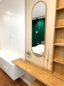 a bathroom with a large mirror and a sink at San Pietro Villa 2 in Draç +13 photos