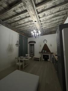 a living room with a table and a fireplace at Chez Sophie in La Spezia