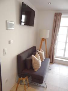 TV a/nebo společenská místnost v ubytování Bella Riva Hotel