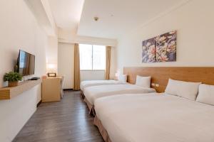 Guide Education Culture Hotel Kaohsiung Museum of Fine Arts客房内的一张或多张床位