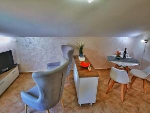Телевизор и/или развлекательный центр в Apartments Villa PM
