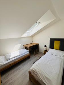 Postel nebo postele na pokoji v ubytování Apartmány Panorama Harrachov