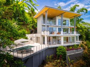 an aerial view of a house with a wrap around deck at Villa Vista Del Mar - by Pura Villas in Dominical