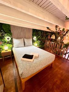 a bedroom with a bed with a tray on it at Jungle avec Jaccuzi au coeur de Nice in Nice