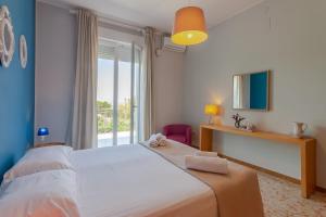Кровать или кровати в номере VILLA a Sud