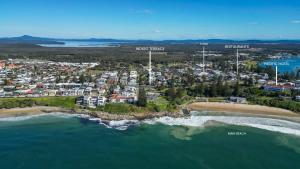 an aerial view of a beach with a city at Indigo Terrace One - Oceanstays in Yamba