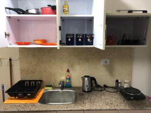 a kitchen counter top with a sink and a counter top at قريه اكوا فيو الساحل الشمالى in El Alamein