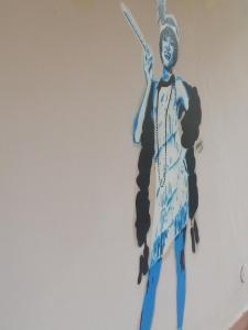 a painting of anubis on a wall at Art & Jazz Hotel in Catania