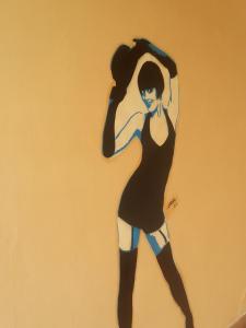 a drawing of a woman in a black dress at Art & Jazz Hotel in Catania