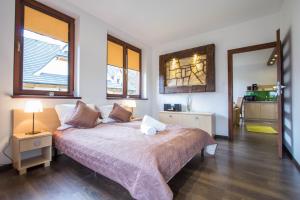 Posteľ alebo postele v izbe v ubytovaní Dolina Resort Zakopane