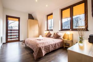 Posteľ alebo postele v izbe v ubytovaní Dolina Resort Zakopane
