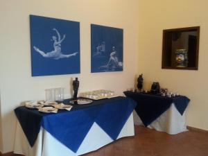 two tables in a room with blue and white table cloth at Art & Jazz Hotel in Catania +37 photos