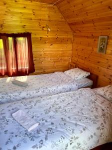 Postel nebo postele na pokoji v ubytování Little Garden House