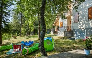 a group of play tents in a yard next to a tree at 5 Bedroom Nice Home In Termoli in Termoli