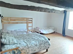 a bedroom with two bunk beds in a room at Grande maison de famille - Le Petit Pontébart in Paimpol