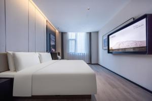 A television and/or entertainment centre at Atour Hotel Wuhan Optics Valley Plaza Nationalities University